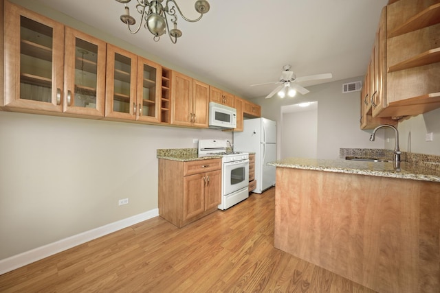 924 Coach Rd Unit 1, Palatine, IL 60074 - kitchen featuring white appliances, open shelves, a sink, light wood-type flooring, and baseboards