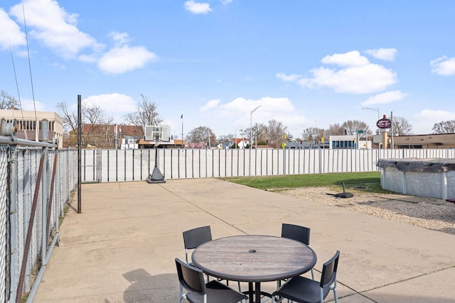 view of patio / terrace featuring fence