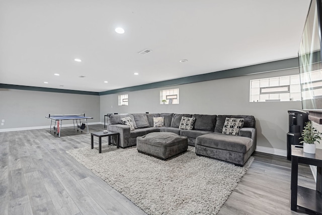 living area with recessed lighting, wood finished floors, and baseboards