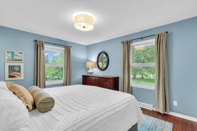 1104 Parkview Dr, Mahomet, IL 61853 - bedroom featuring baseboards and dark wood finished floors