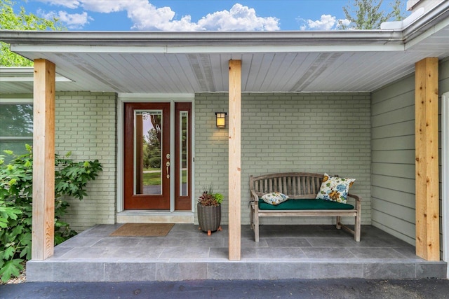 1104 Parkview Dr, Mahomet, IL 61853 - doorway to property featuring brick siding and covered porch