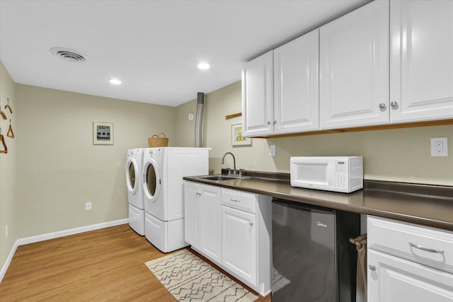 1104 Parkview Dr, Mahomet, IL 61853 - laundry room featuring washer and clothes dryer, light wood-type flooring, and recessed lighting