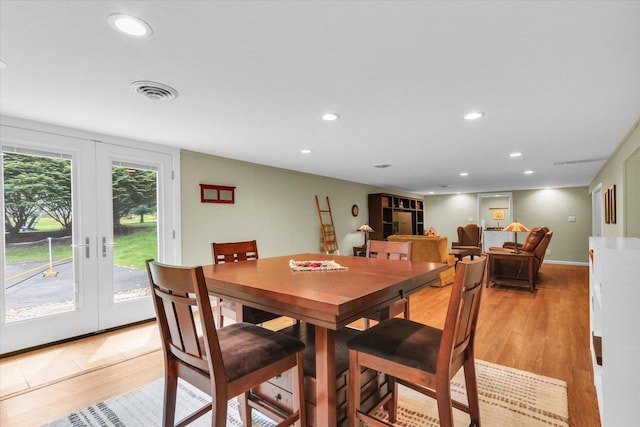 1104 Parkview Dr, Mahomet, IL 61853 - dining area with recessed lighting, french doors, and light wood-type flooring