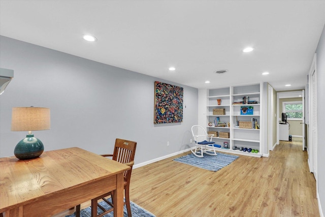 1104 Parkview Dr, Mahomet, IL 61853 - dining space featuring light wood-style floors, recessed lighting, and built in features
