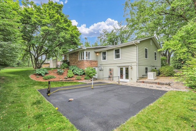 1104 Parkview Dr, Mahomet, IL 61853 - back of house featuring french doors and a yard