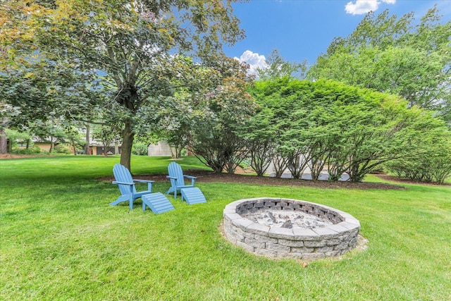 1104 Parkview Dr, Mahomet, IL 61853 - view of grassy yard with an outdoor fire pit