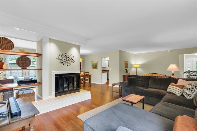 1104 Parkview Dr, Mahomet, IL 61853 - living area featuring wood finished floors, a tiled fireplace, and recessed lighting