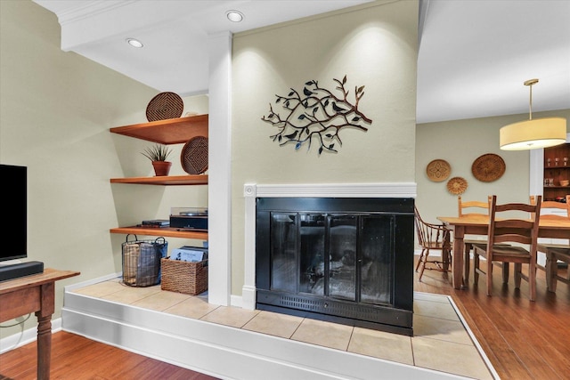 1104 Parkview Dr, Mahomet, IL 61853 - living area featuring a tiled fireplace, wood finished floors, and recessed lighting