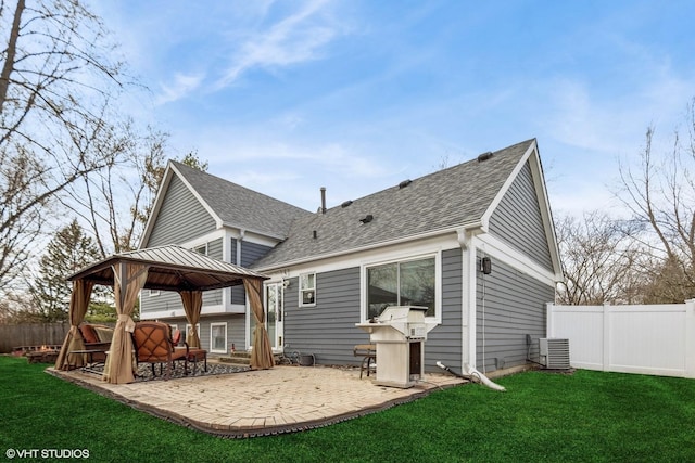 back of house featuring a gazebo, a yard, fence, and a patio area