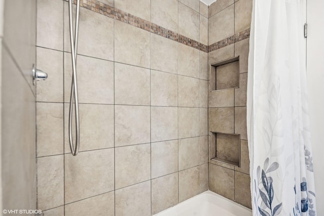 full bathroom with a tile shower