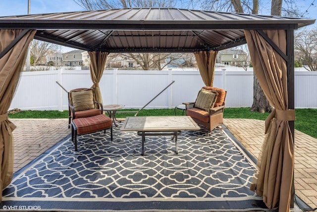 view of patio / terrace with a gazebo and a fenced backyard