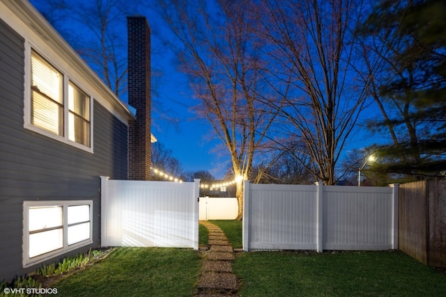 view of yard with a fenced backyard