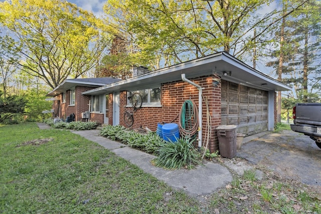 14750 W Hickory Ave, Lemont, IL 60439 - view of home's exterior with brick siding, a garage, and a lawn