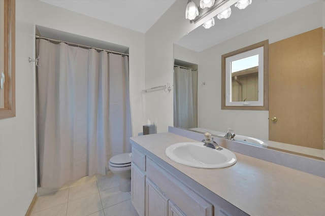 bathroom featuring vanity, toilet, and tile patterned flooring