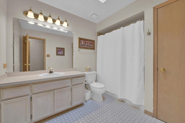 full bathroom featuring visible vents, toilet, and vanity