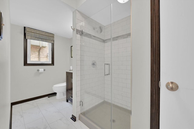 full bathroom with toilet, a stall shower, baseboards, marble finish floor, and vanity