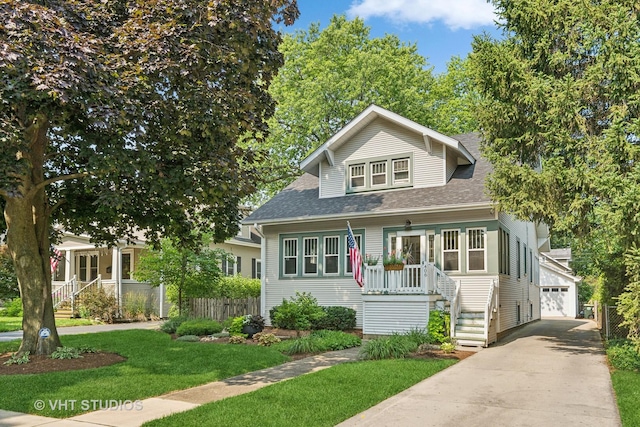 406 S Evergreen Ave, Arlington Heights, IL 60005 - bungalow-style home with roof with shingles and a detached garage