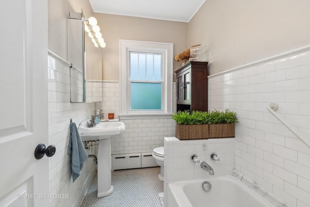 406 S Evergreen Ave, Arlington Heights, IL 60005 - full bathroom featuring a baseboard heating unit, tile walls, a bathtub, tile patterned flooring, and a wainscoted wall