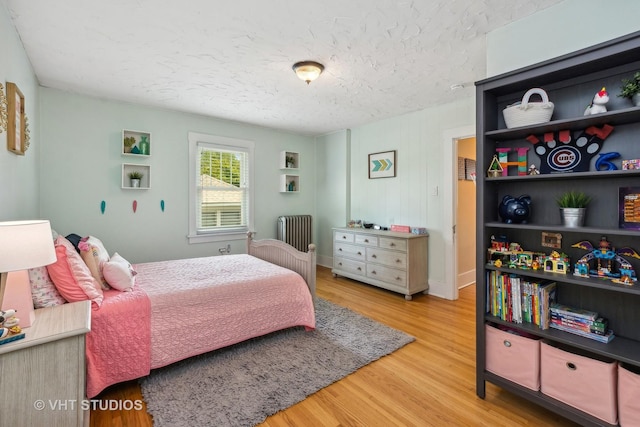 406 S Evergreen Ave, Arlington Heights, IL 60005 - bedroom featuring radiator, wood finished floors, and a textured ceiling