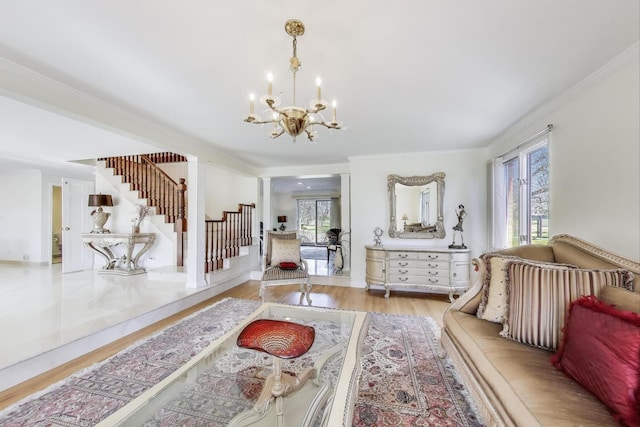 interior space with a wealth of natural light, stairway, a notable chandelier, and crown molding