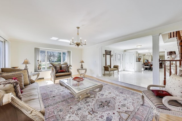 living area featuring an inviting chandelier, crown molding, and wood finished floors
