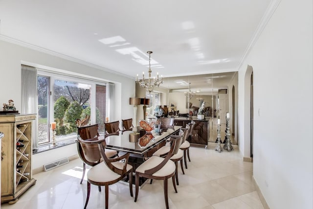 dining area with ornamental molding, visible vents, and light tile patterned flooring