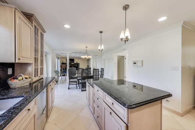 kitchen with stainless steel dishwasher, recessed lighting, a center island, and a chandelier