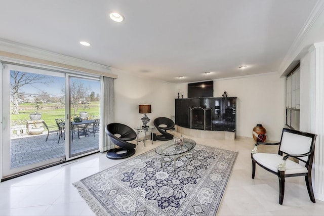 living area with ornamental molding and recessed lighting