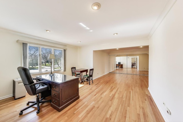 home office with crown molding, recessed lighting, baseboards, and light wood-style floors