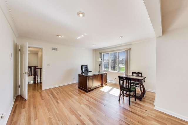 office area featuring visible vents, baseboards, ornamental molding, light wood-type flooring, and recessed lighting