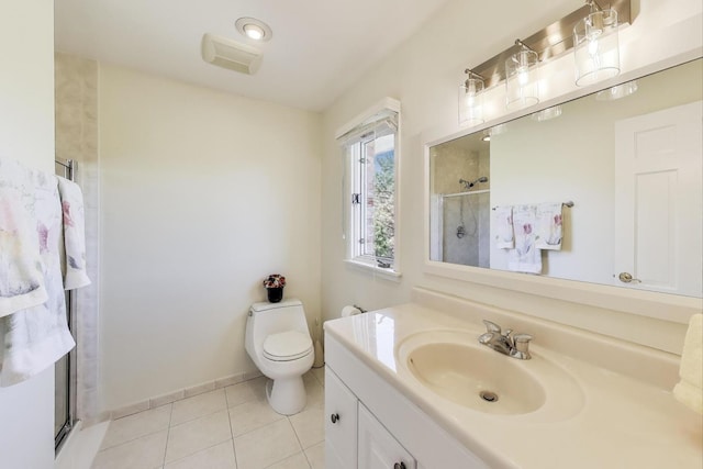 full bathroom featuring tile patterned flooring, toilet, a stall shower, and vanity