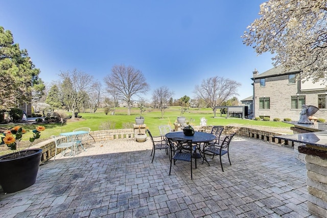 view of patio featuring outdoor dining area