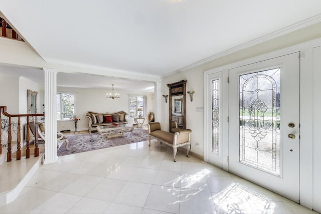foyer featuring light tile patterned floors, baseboards, decorative columns, a chandelier, and stairway