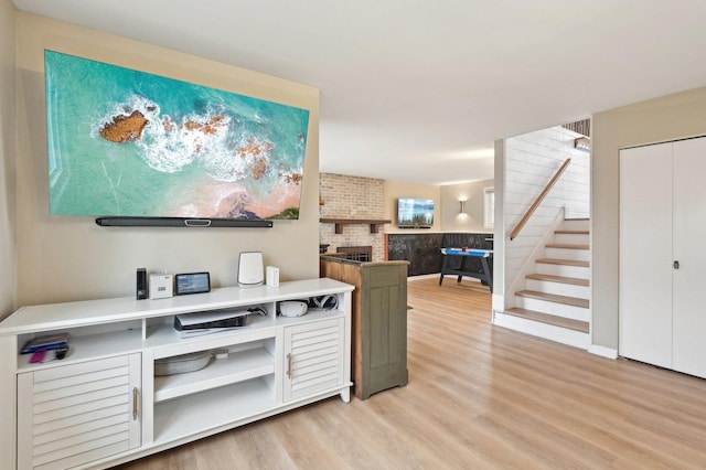 interior space featuring light wood-style flooring and stairway