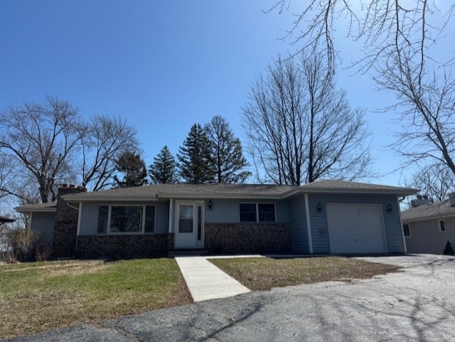 707 Crestview Dr, Ingleside, IL 60041 - ranch-style home featuring an attached garage, driveway, and a front lawn