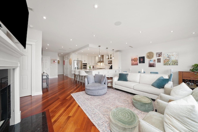 2041 W Division St Unit 304, Chicago, IL 60622 - living room featuring recessed lighting, wood finished floors, and a fireplace