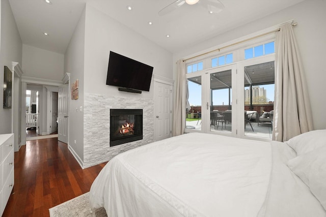 2041 W Division St Unit 304, Chicago, IL 60622 - bedroom featuring a glass covered fireplace, access to exterior, dark wood-style floors, recessed lighting, and a ceiling fan