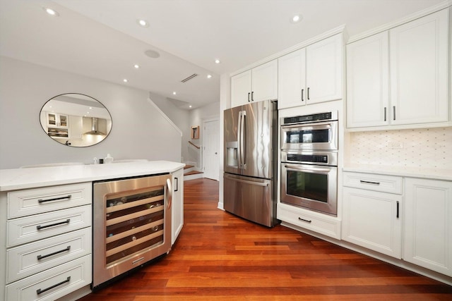 2041 W Division St Unit 304, Chicago, IL 60622 - kitchen with tasteful backsplash, beverage cooler, stainless steel appliances, white cabinetry, and dark wood-type flooring