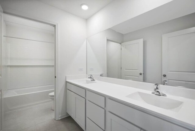 9948 Central Park Blvd, Huntley, IL 60142 - bathroom featuring toilet, double vanity, a sink, and tile patterned flooring