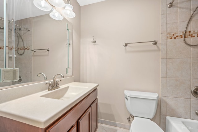bathroom with vanity, baseboards, tile patterned floors, shower / tub combination, and toilet