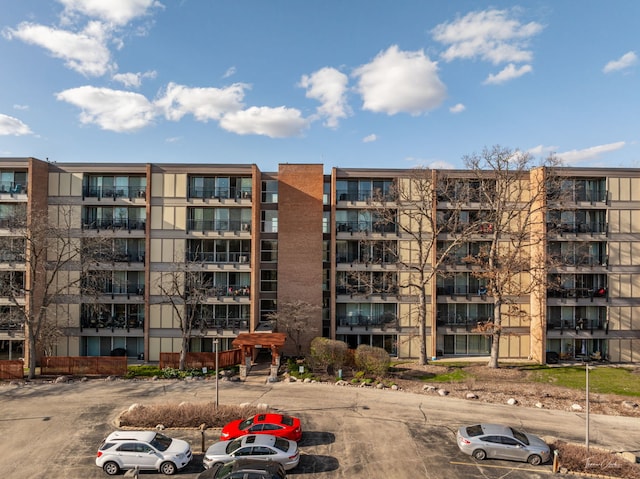 view of property featuring uncovered parking