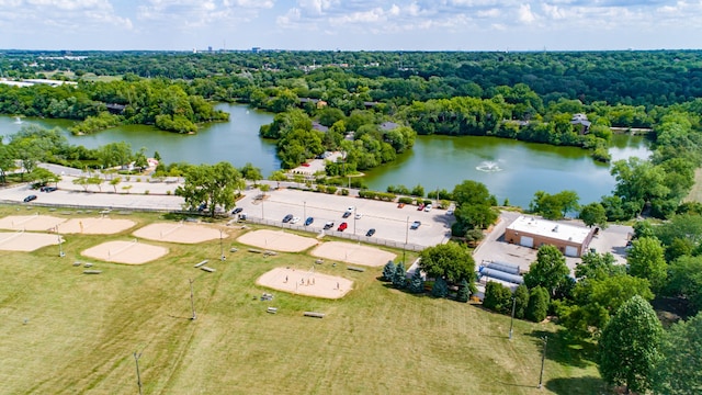 bird's eye view featuring a water view and a wooded view