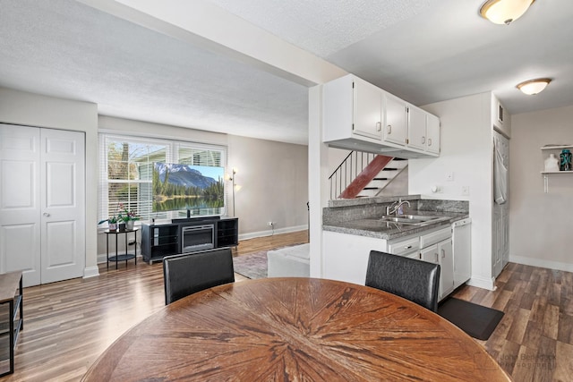 1290 Pleasant Ave Unit C, Glendale Heights, IL 60139 - dining room featuring a textured ceiling, wood finished floors, baseboards, and stairs