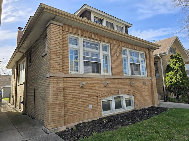 view of home's exterior featuring brick siding