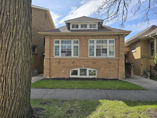 view of front of home featuring brick siding