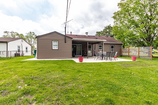 rear view of property with a patio area and central air condition unit