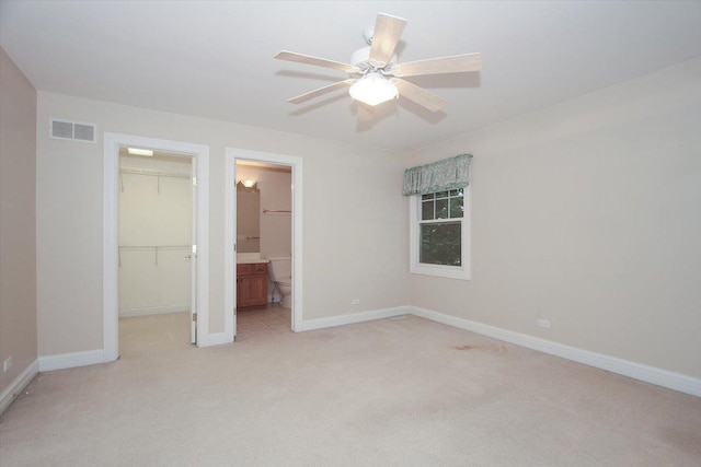 37 River Ridge Drive, Sleepy Hollow, IL 60118 - unfurnished bedroom with a spacious closet, light colored carpet, a closet, ensuite bath, and ceiling fan
