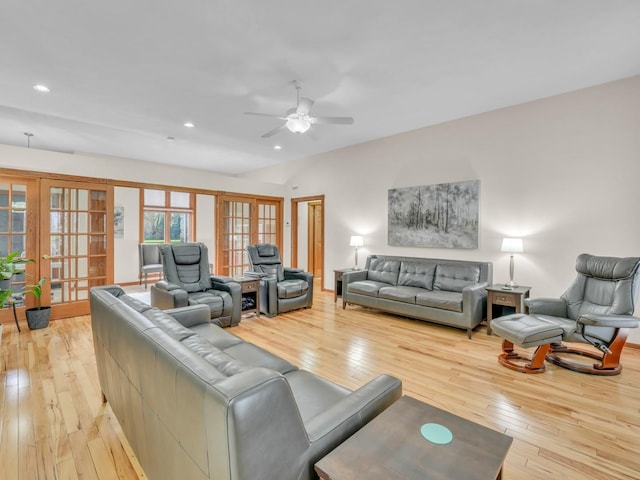 living room with light wood-style floors, a ceiling fan, recessed lighting, and french doors