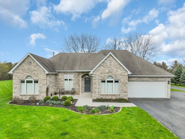 ranch-style home with brick siding, aphalt driveway, an attached garage, and roof with shingles