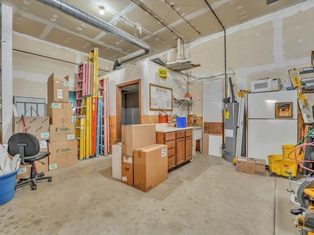 interior space with freestanding refrigerator and water heater